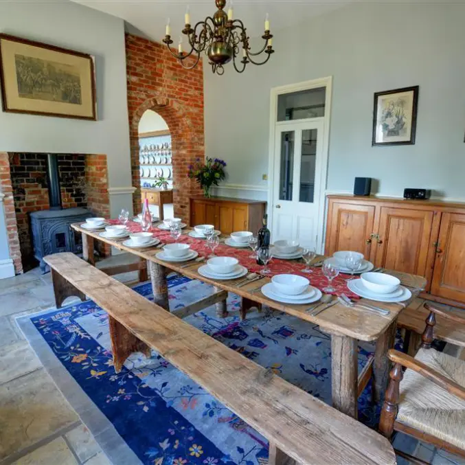 Large dining room at Bessingham Manor set up for group meals